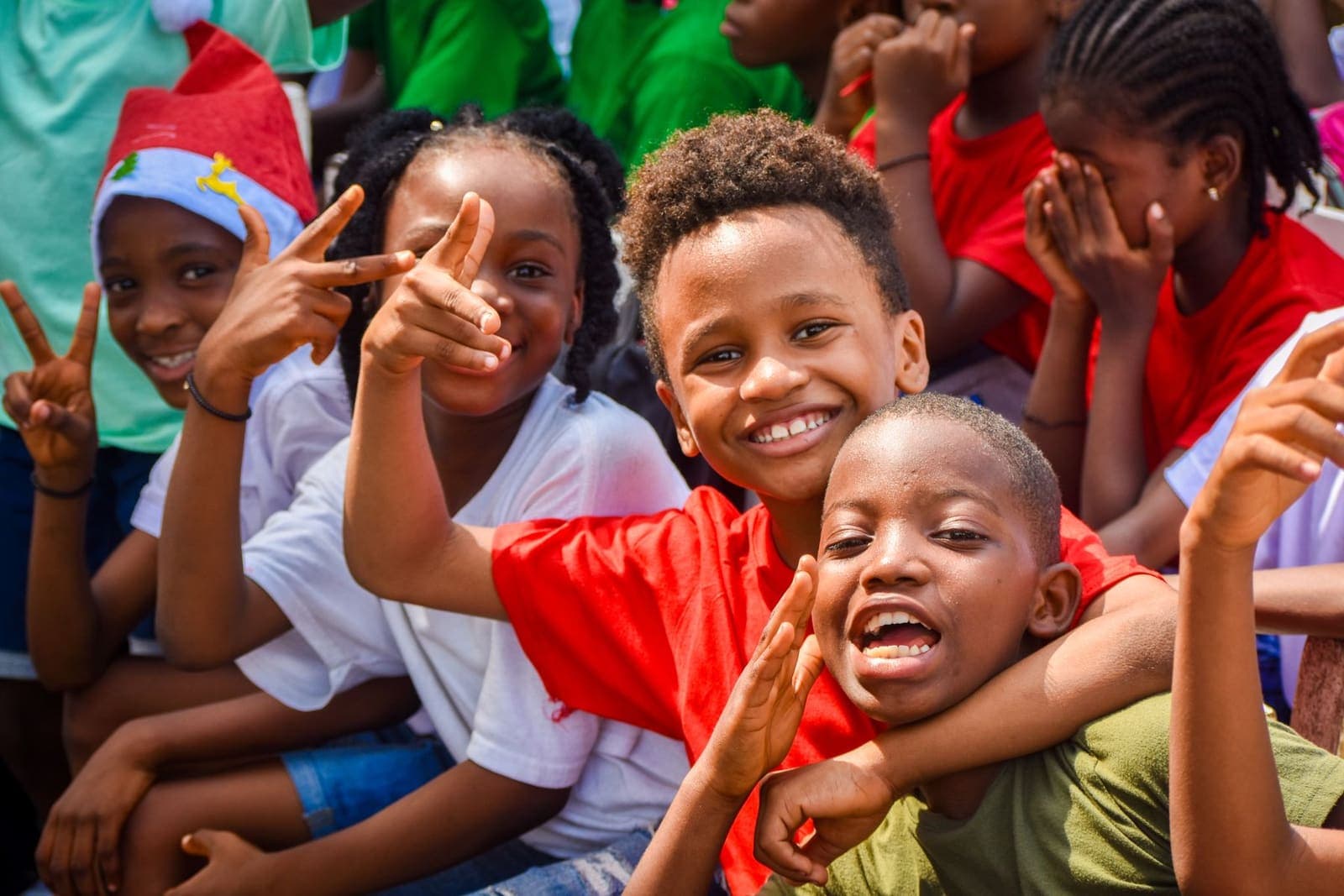 Joyful primary school children smiling together outdoors