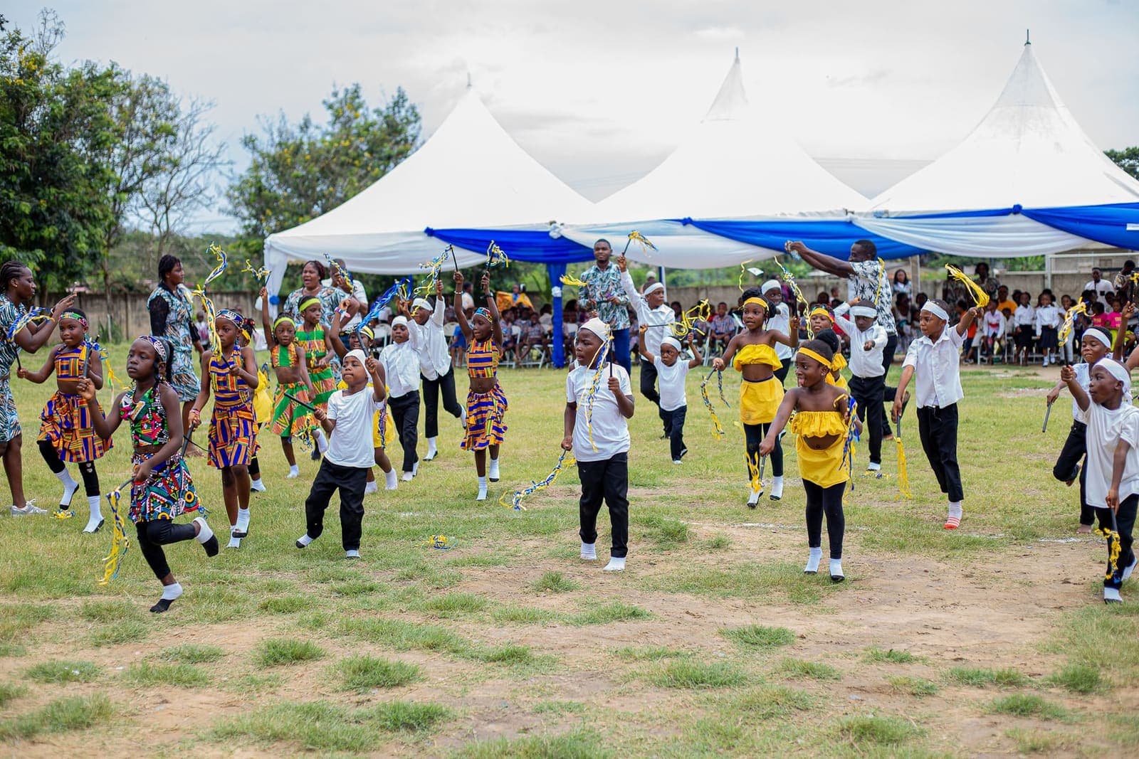 Children in traditional dress taking part in a cultural celebration