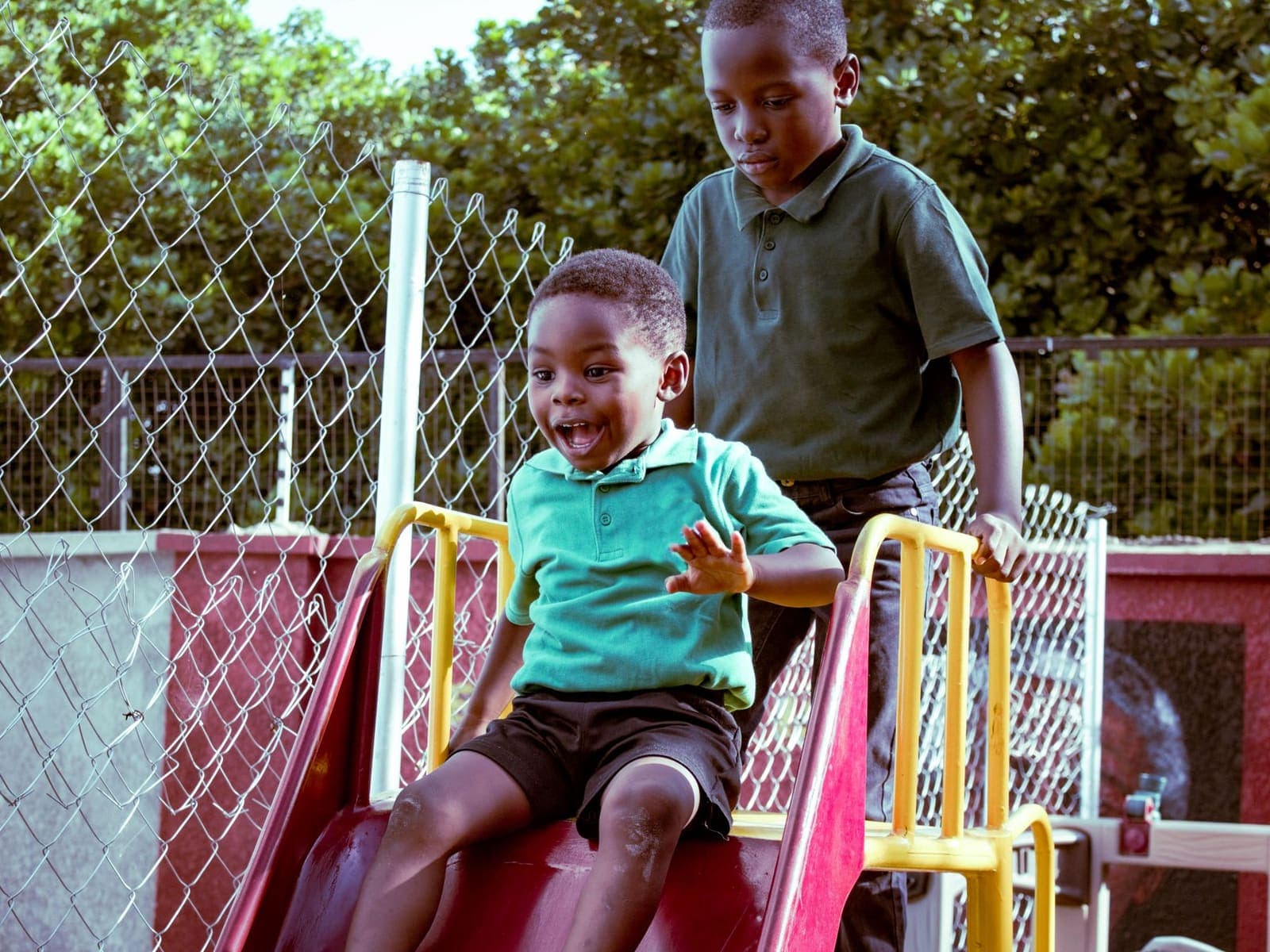 Children playing happily on outdoor playground equipment