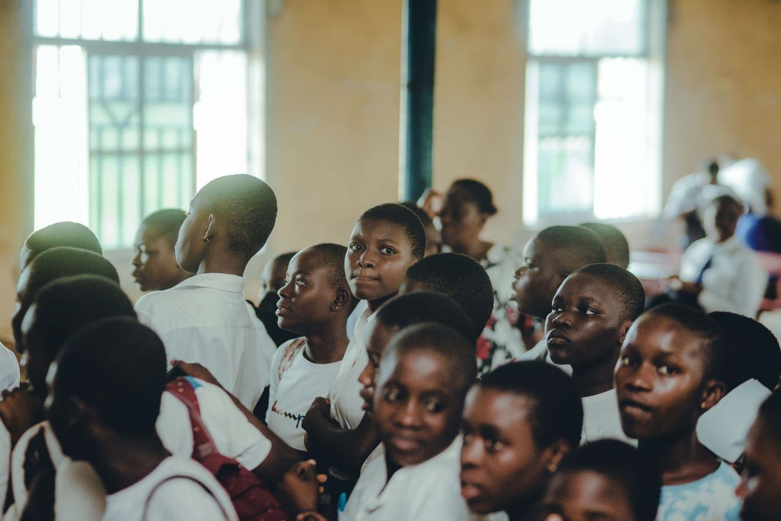 Pupils seated together during a school assembly